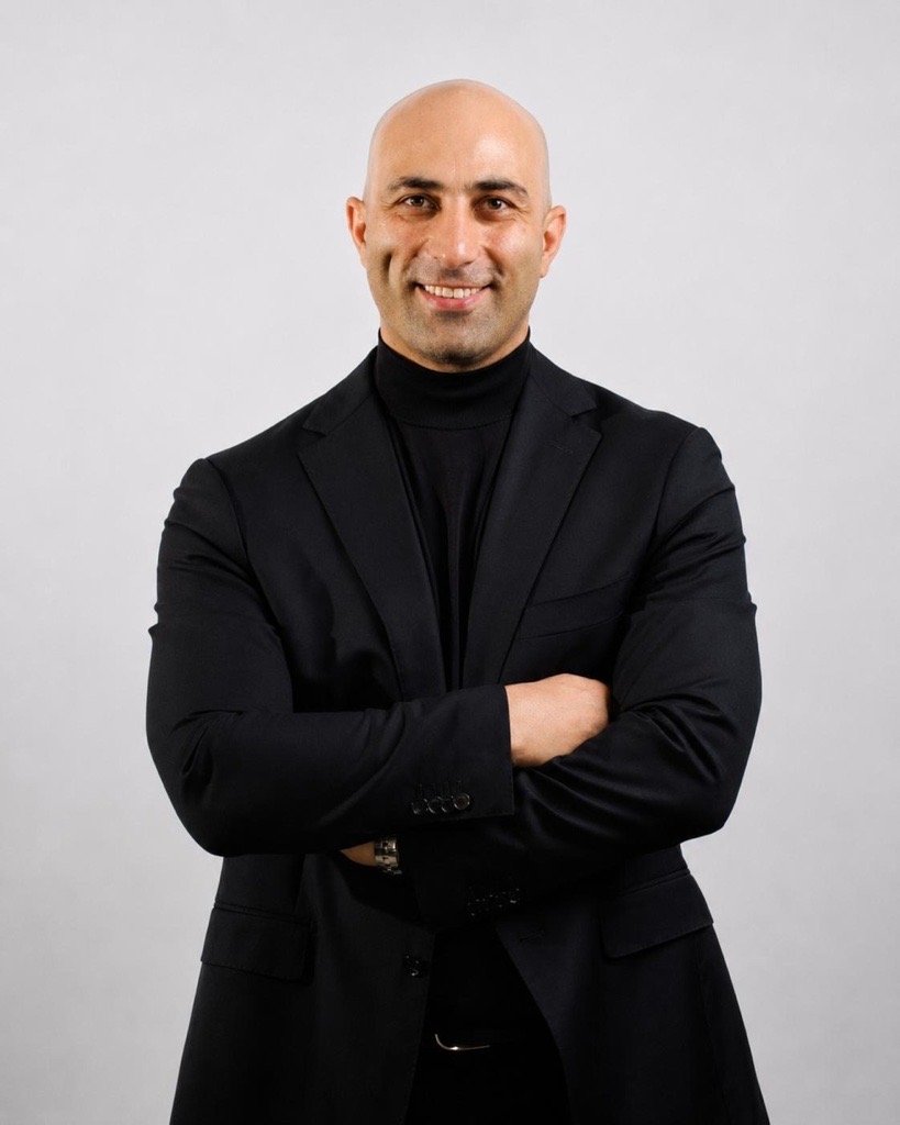 Sam Gohari Founder & Principal Architect For Sam, architecture has always been about connection — connecting people with places, ideas with opportunities, and a talented team around a shared vision. As the founder and studio leader of Sami Design, Sam brings together the creative, technical and commercial sides of architecture. He works closely with clients to understand not only what they want to build, but why they want to build it, helping uncover possibilities and find a way forward when a project becomes challenging. With experience across architecture, construction and property development, Sam sees projects from more than one perspective. He is passionate about creating architecture that responds to people, place and nature, with sustainability and long-term value at the heart of the design. Within the studio, Sam is the connector — bringing together the team, clients, consultants, builders and ideas that make each project possible. He believes great architecture comes from strong relationships, open conversations and surrounding yourself with people who bring different strengths to the table. Outside the studio, Sam enjoys playing guitar, travelling, sport and spending time with his family. He loves meeting people, hearing their stories and building connections — something that naturally finds its way back into how he approaches architecture and leads Sami Design.